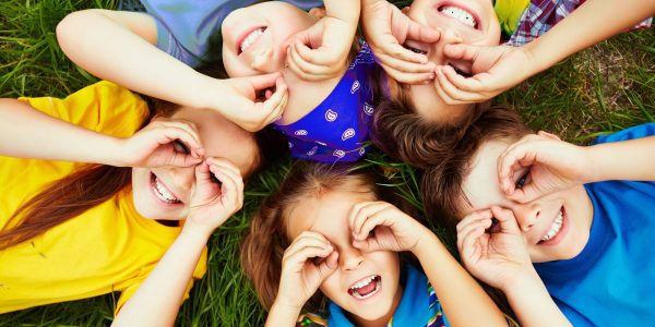 Children resting Group of cute children lying on grass